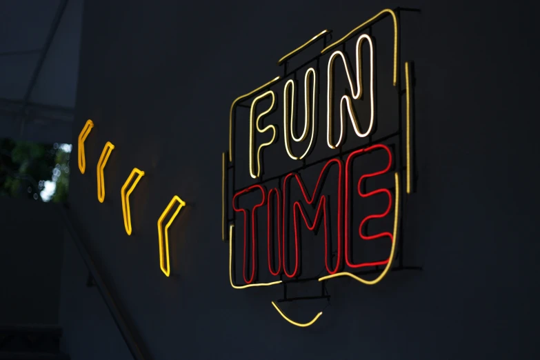 a neon sign that says fun time and a donut