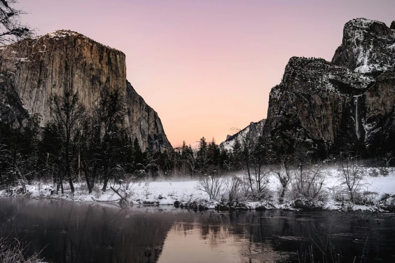 a landscape image of mountains and snowy water