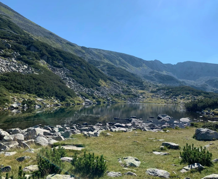 a mountain lake with rocks around it