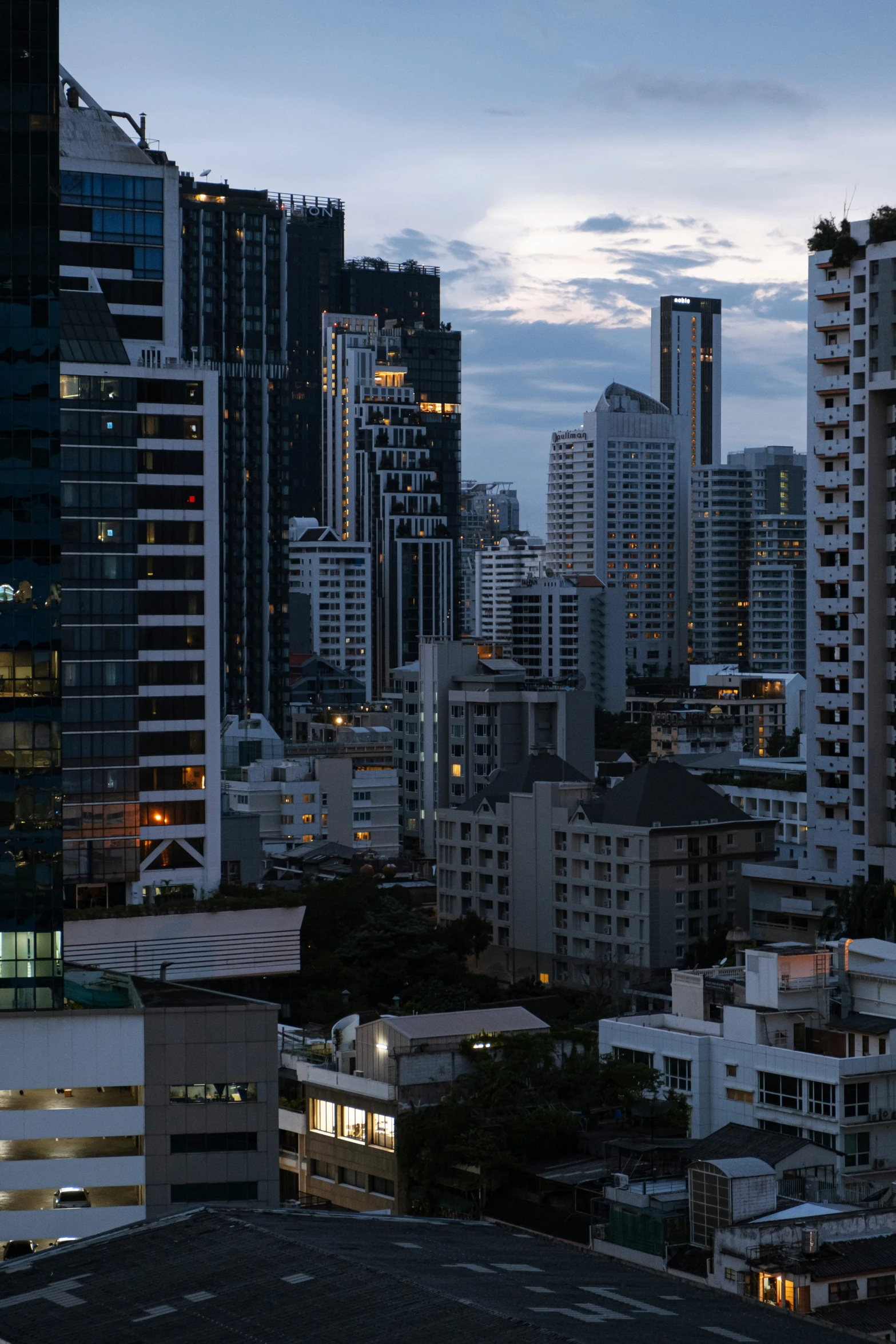 there are buildings in this city at dusk