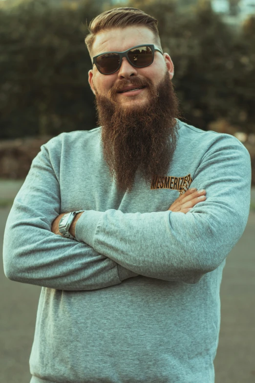 a man with sunglasses on his head and a beard