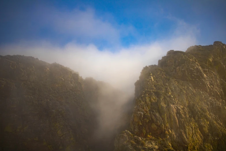 the mists coming down the mountain are creeping