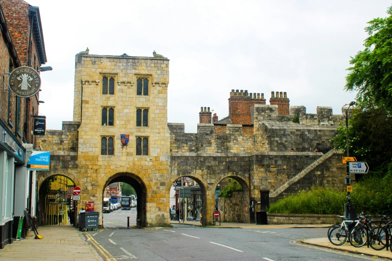 an old castle like building next to a bike path