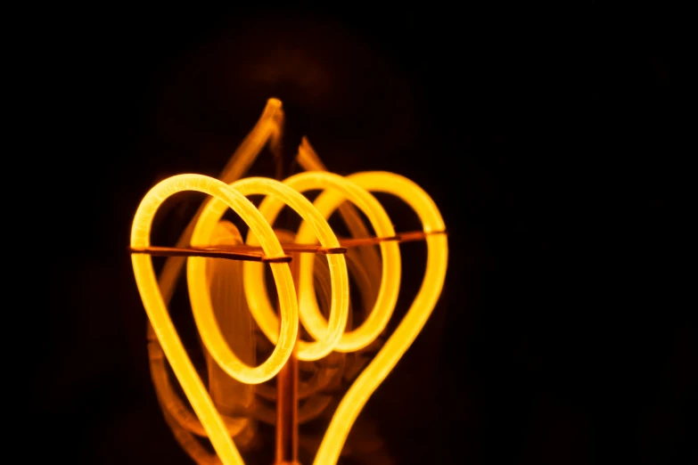 the lights of a light - emitting spiral appear to be shaped like hearts