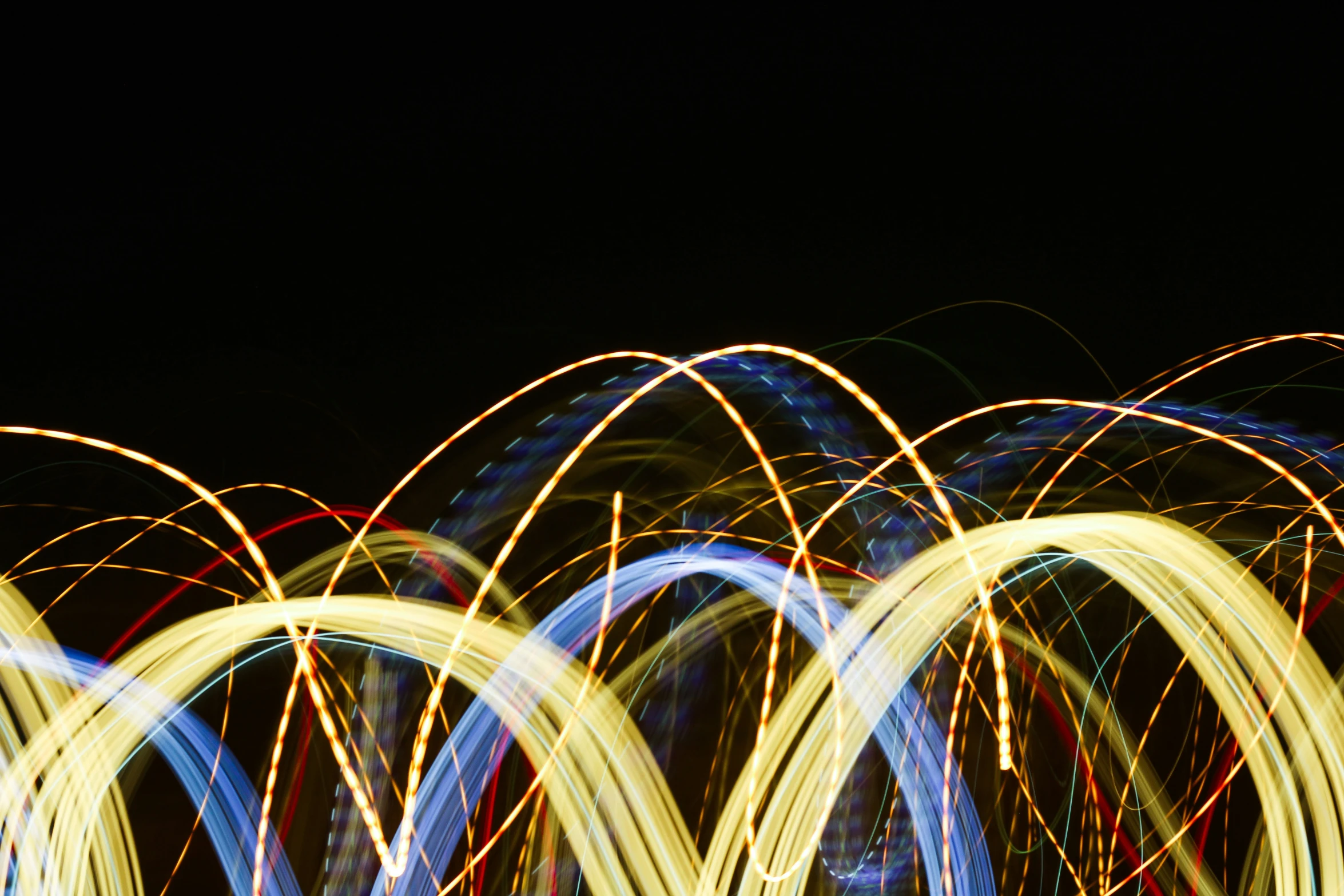 blurry pograph of bright, abstract light streaks