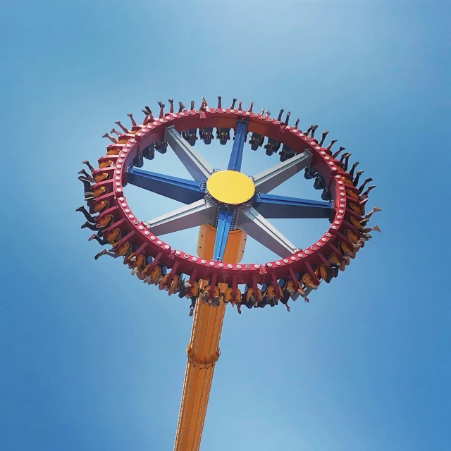 the large ferris wheel is red and blue