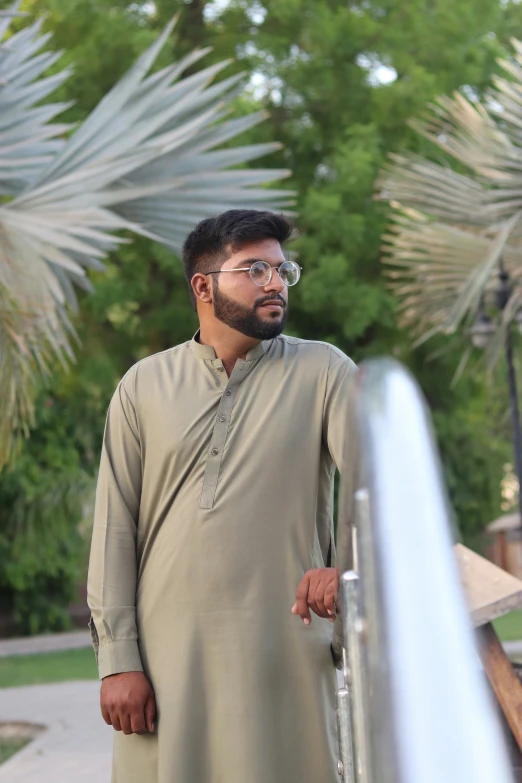 man in a salwar in desert looking into the distance