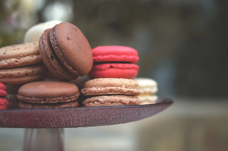 a close up of many different cookies and pastries