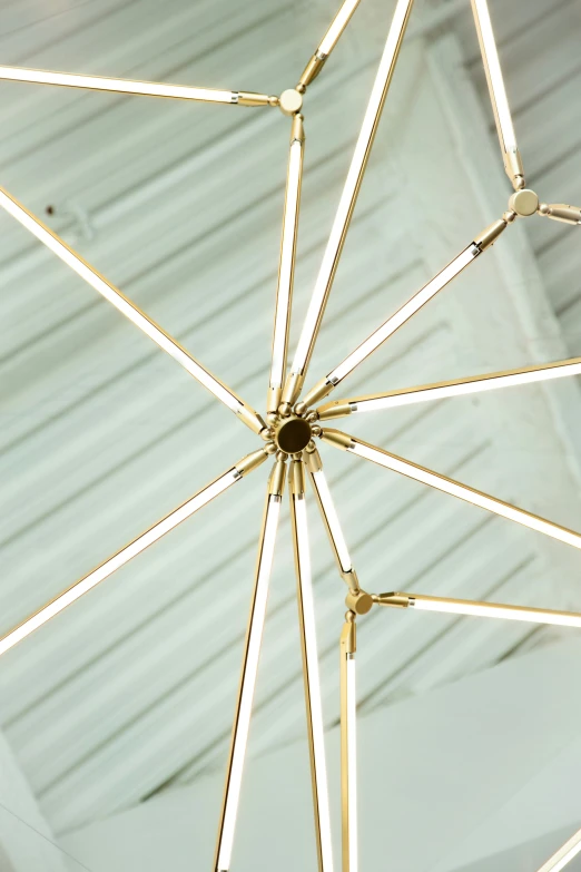 an open umbrella over a metal roof in a building