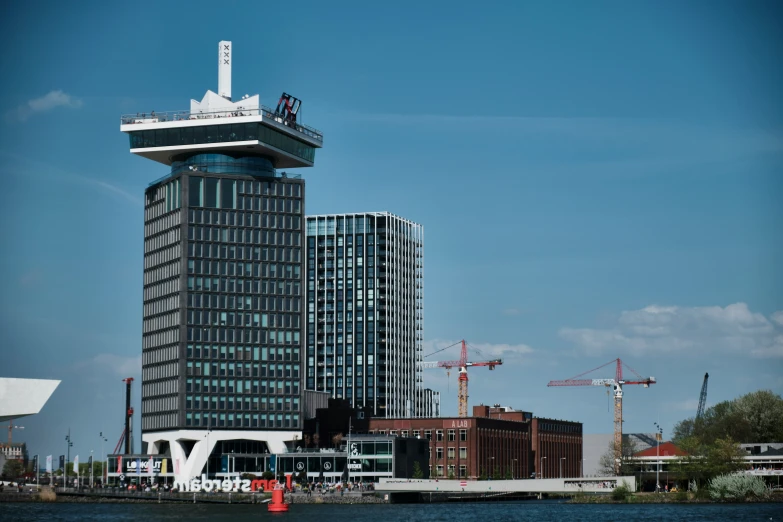 an apartment building on a waterfront in the city