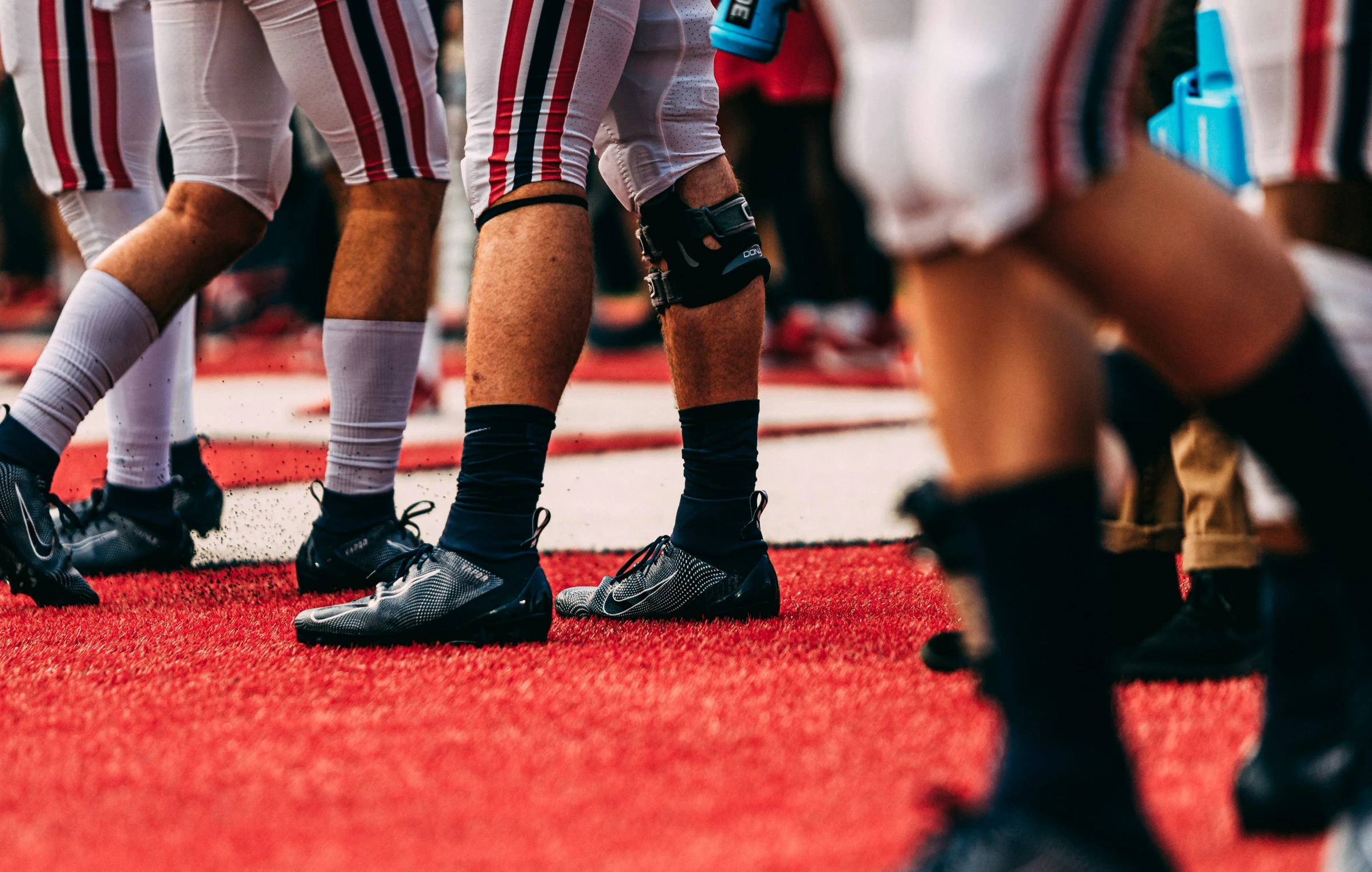 the feet of the football players on a field