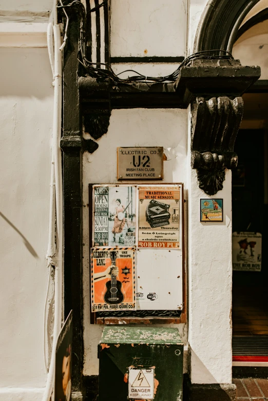 a pograph of an old building with posters