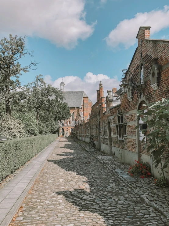 there is a cobblestone street leading up to the building