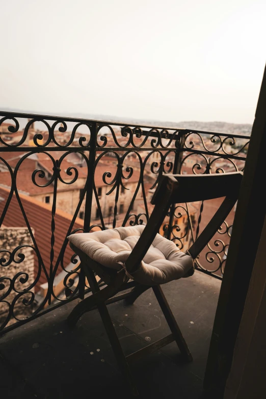 an outdoor chair on top of a building