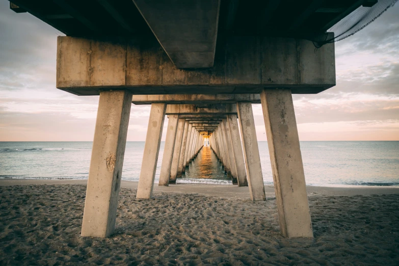 an image of a very long pier by the water