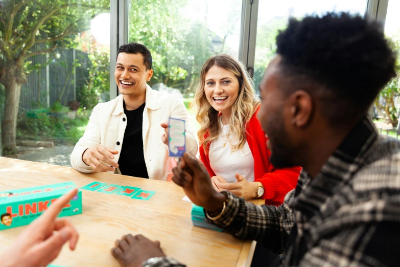 a group of friends playing games at a table