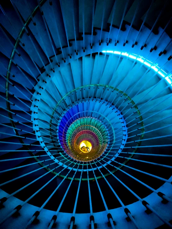 a spiral staircase with some lights lit up