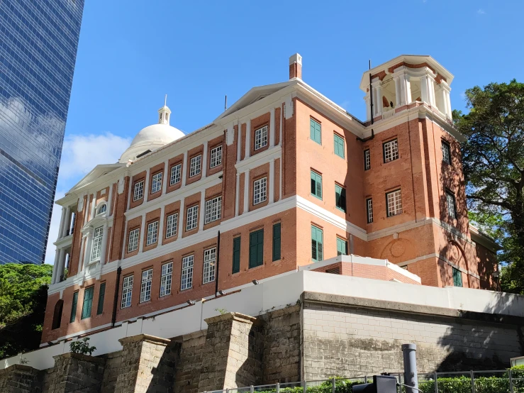 a large building with a clock and a very tall tower