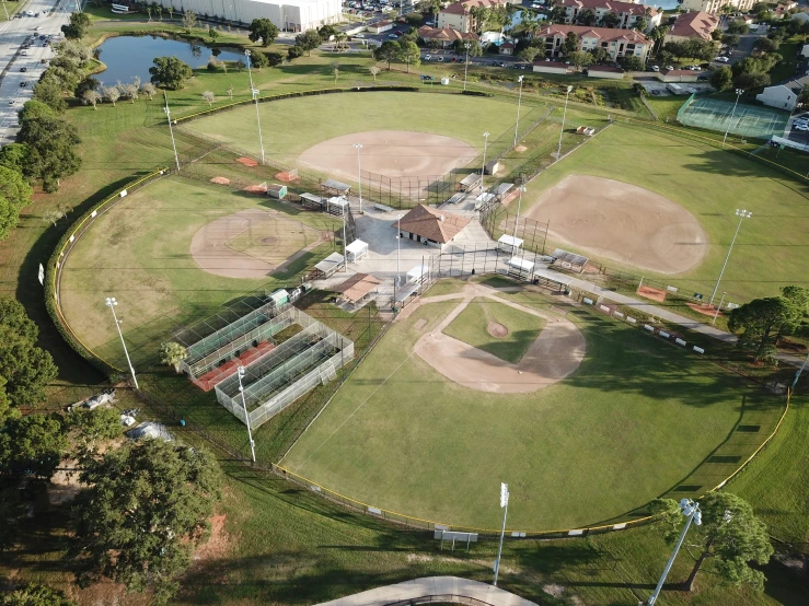 an aerial view of a baseball field near the shore