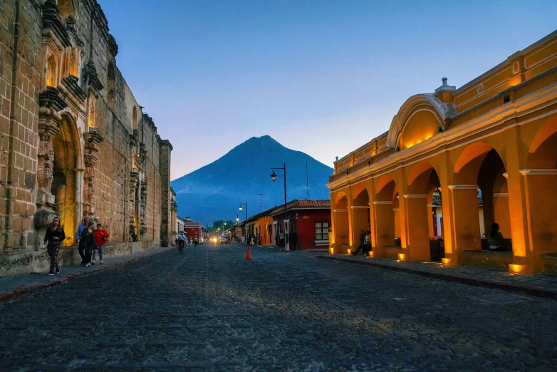 a very old road in front of a large mountain