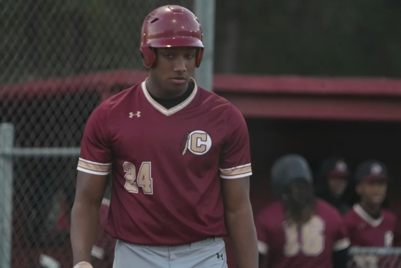 a batter getting ready to swing at the pitch during a game