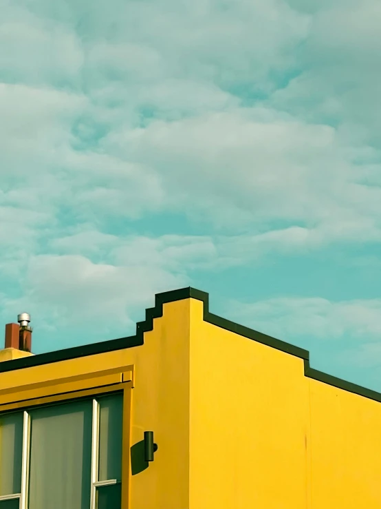 yellow building with two windows on each side