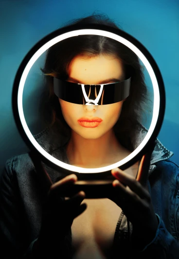 a woman wearing a pair of futuristic glasses looking through a magnifying glass