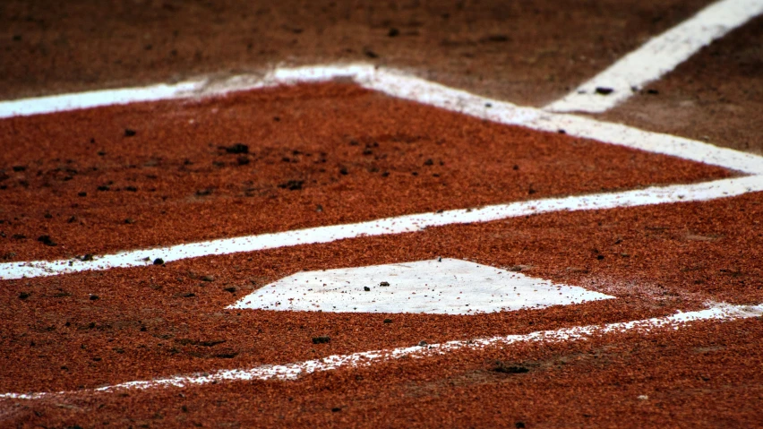 white markings on a baseball diamond in the dirt