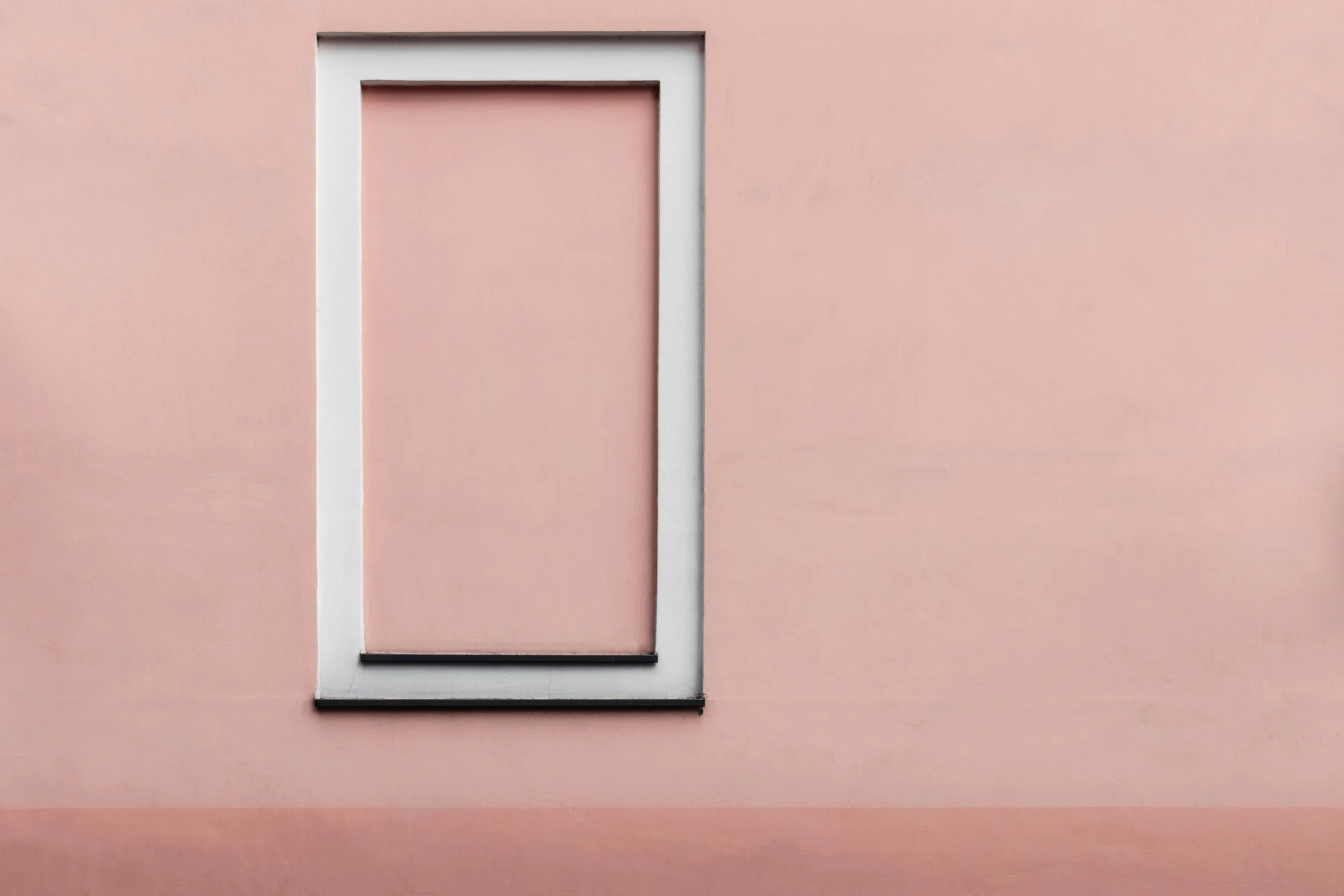 an image of a white frame in the pink wall