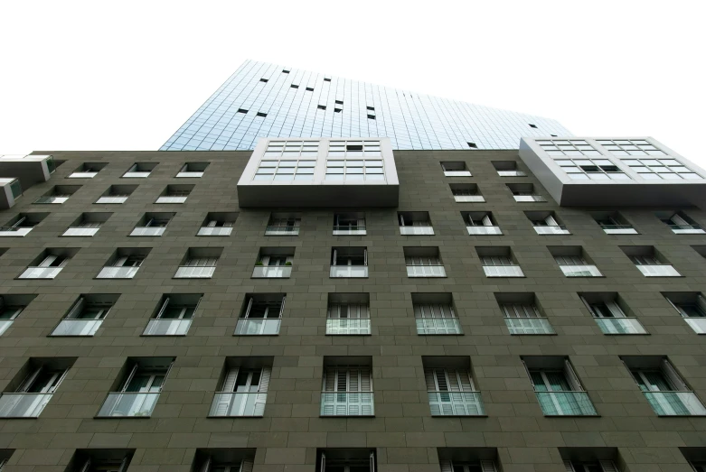 a high rise building against a white sky