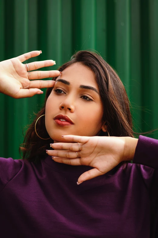 a woman with earrings looking into the distance