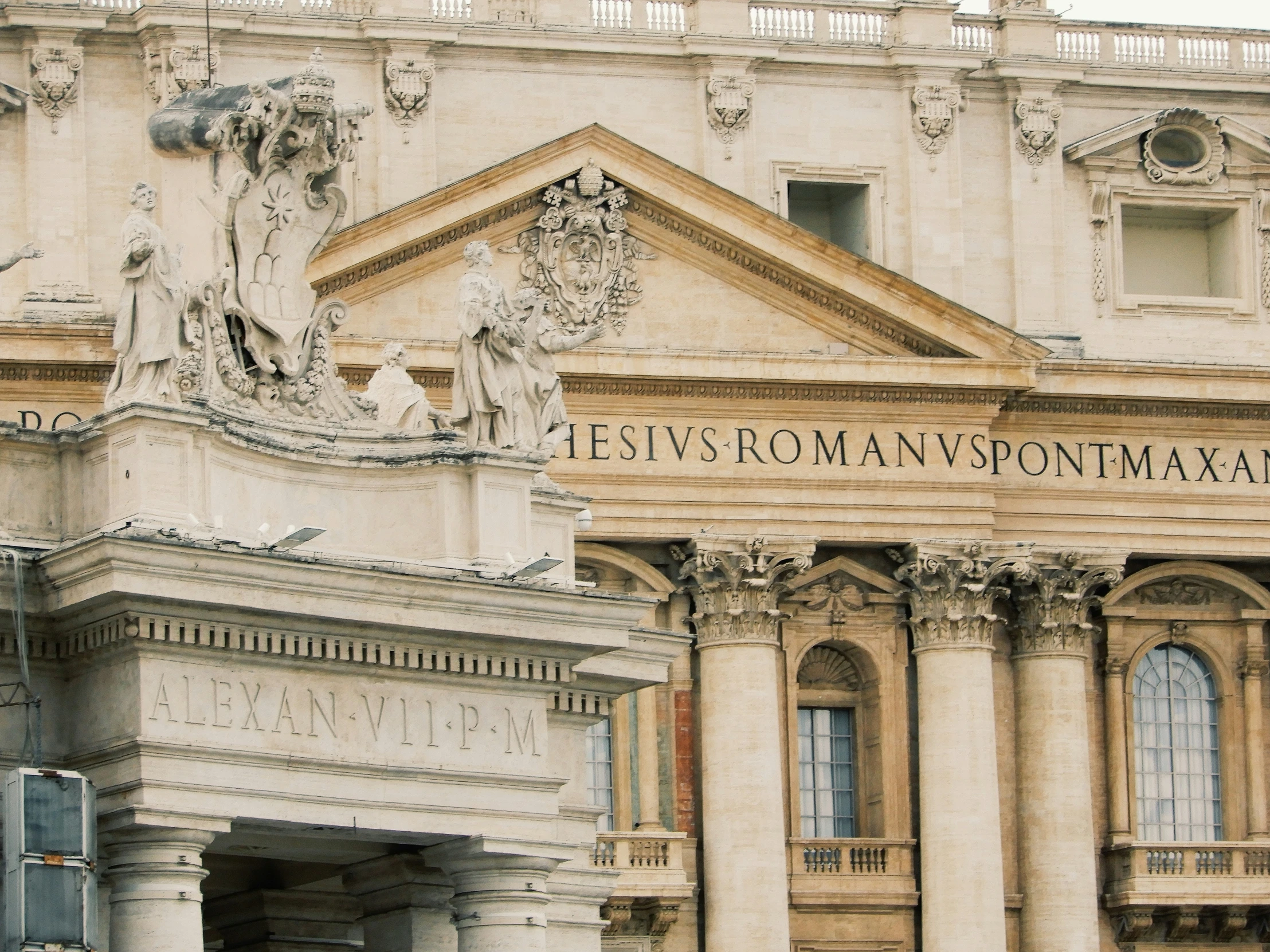 the facade of a building that has a roman advertit on the front