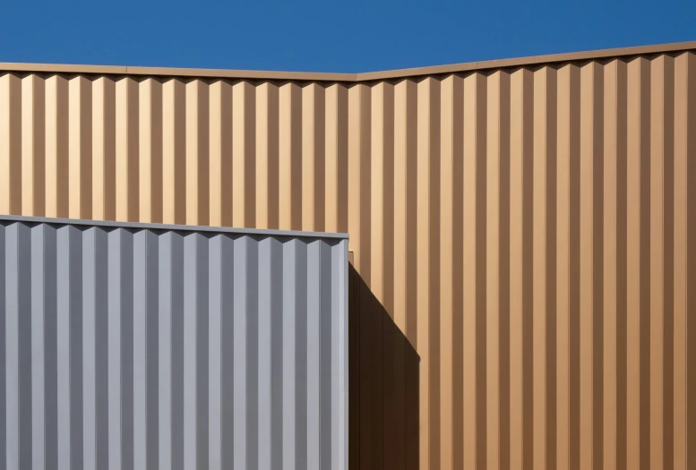 a couple of grey and yellow boxes are on a metal surface