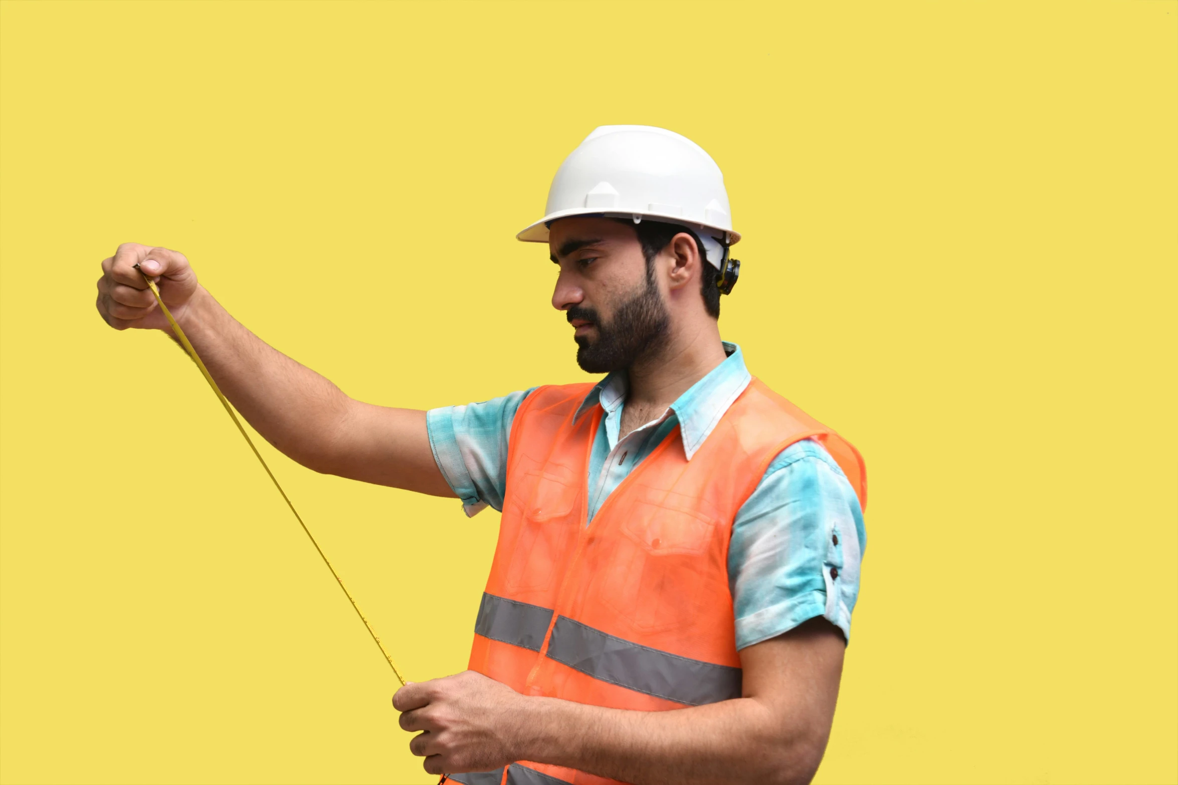 a man in a hard hat holding onto soing on a stick