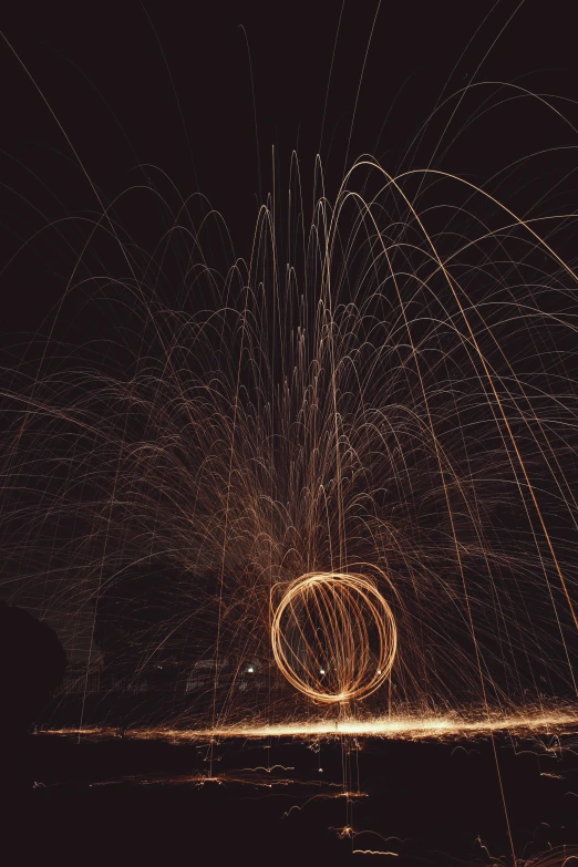 firework shows in the night sky as it flies over water