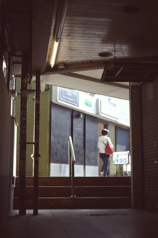 a person getting off of a bus in the subway