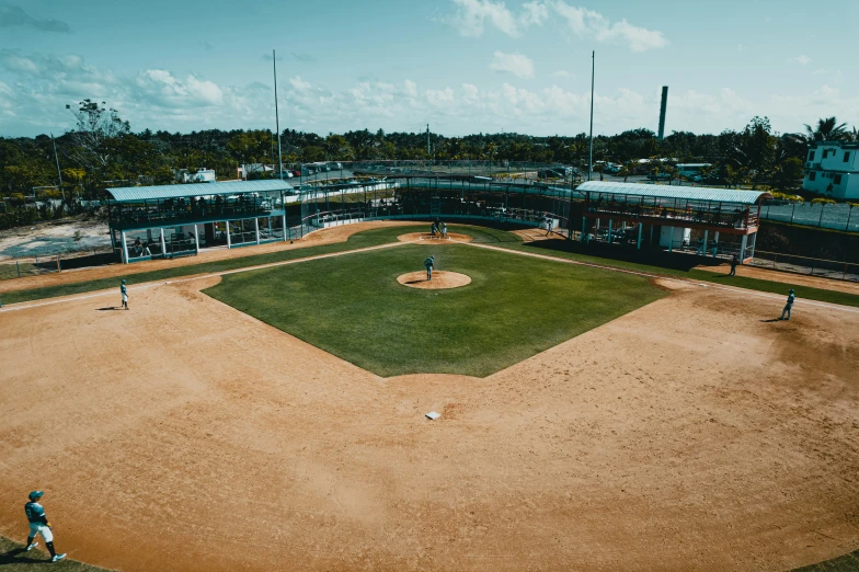 a man is walking to the home plate as he gets ready to pitch a baseball