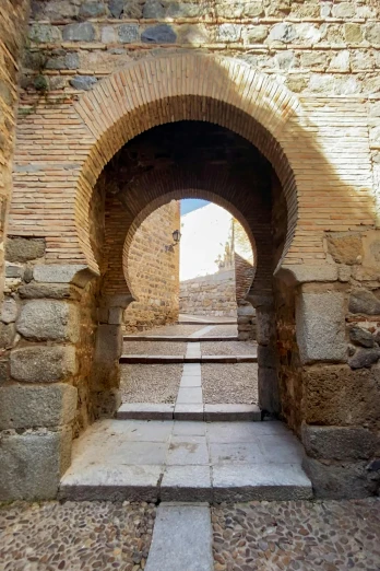 a doorway leading up a brick structure with steps in it