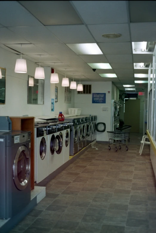 an empty room with a washer and dryers
