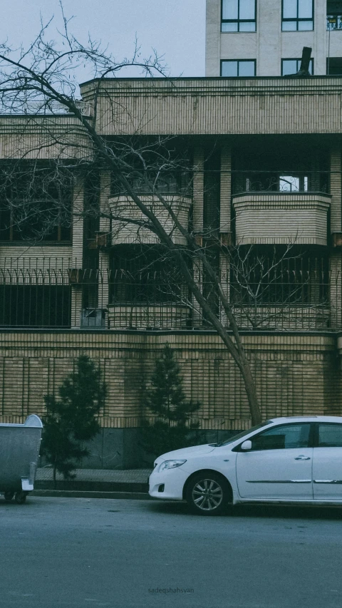 an old building on a city street in a gloomy day