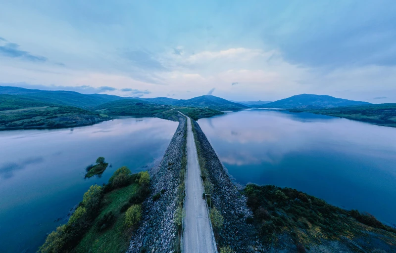 aerial view of a road that runs through a body of water