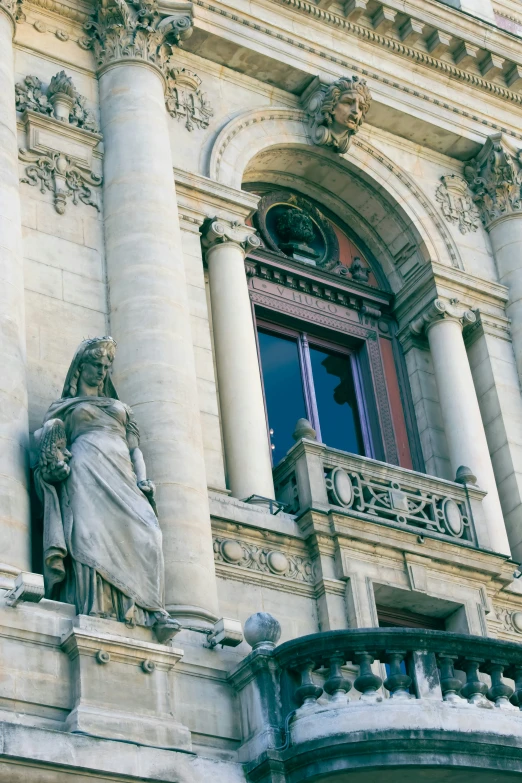 a large building with a statue on it