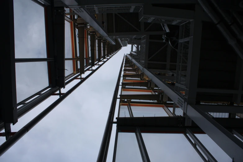 some very tall building reflecting some very cloudy sky