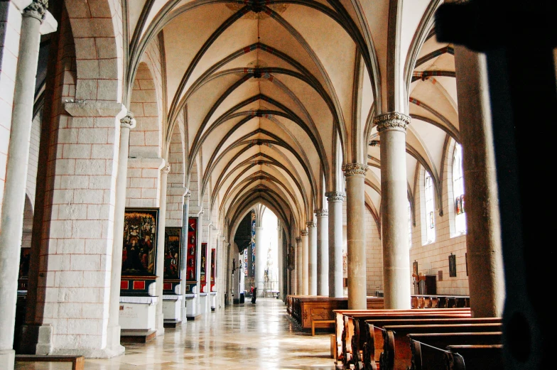 a cathedral full of people sitting down pews