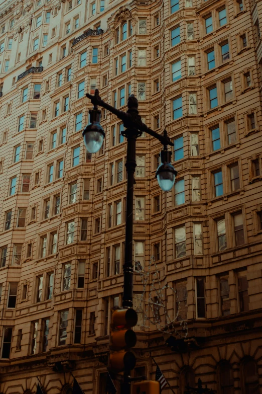 a street light in front of some tall buildings