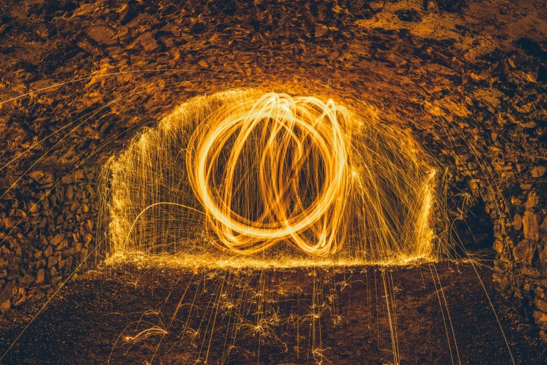 a yellow spiral is in the middle of a tunnel