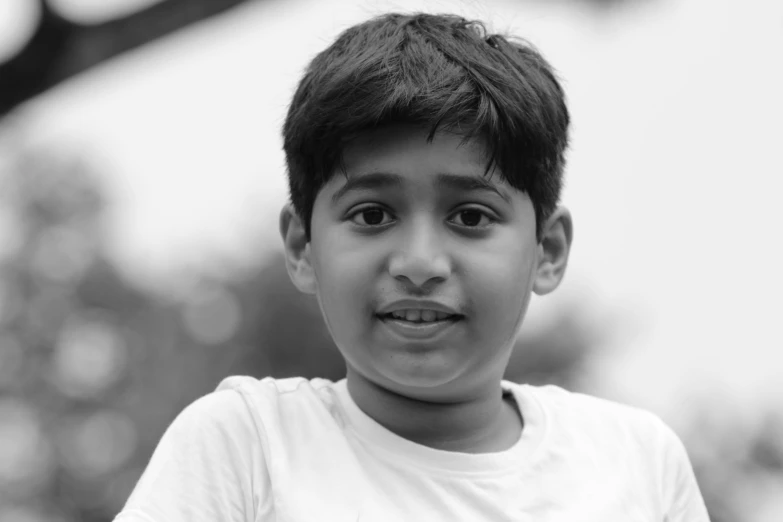 a little boy looking forward with his eyes wide open