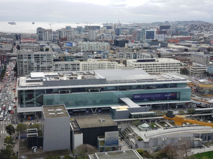 an aerial view of a large building in the city