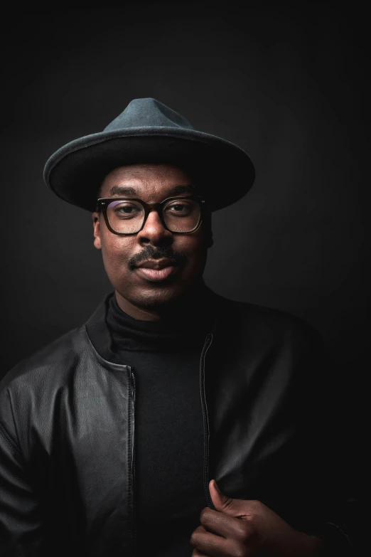 an image of a man with glasses and a hat