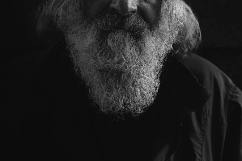 man with long gray hair and a beard